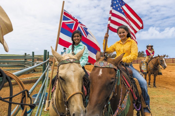 a group of people riding on the back of a horse