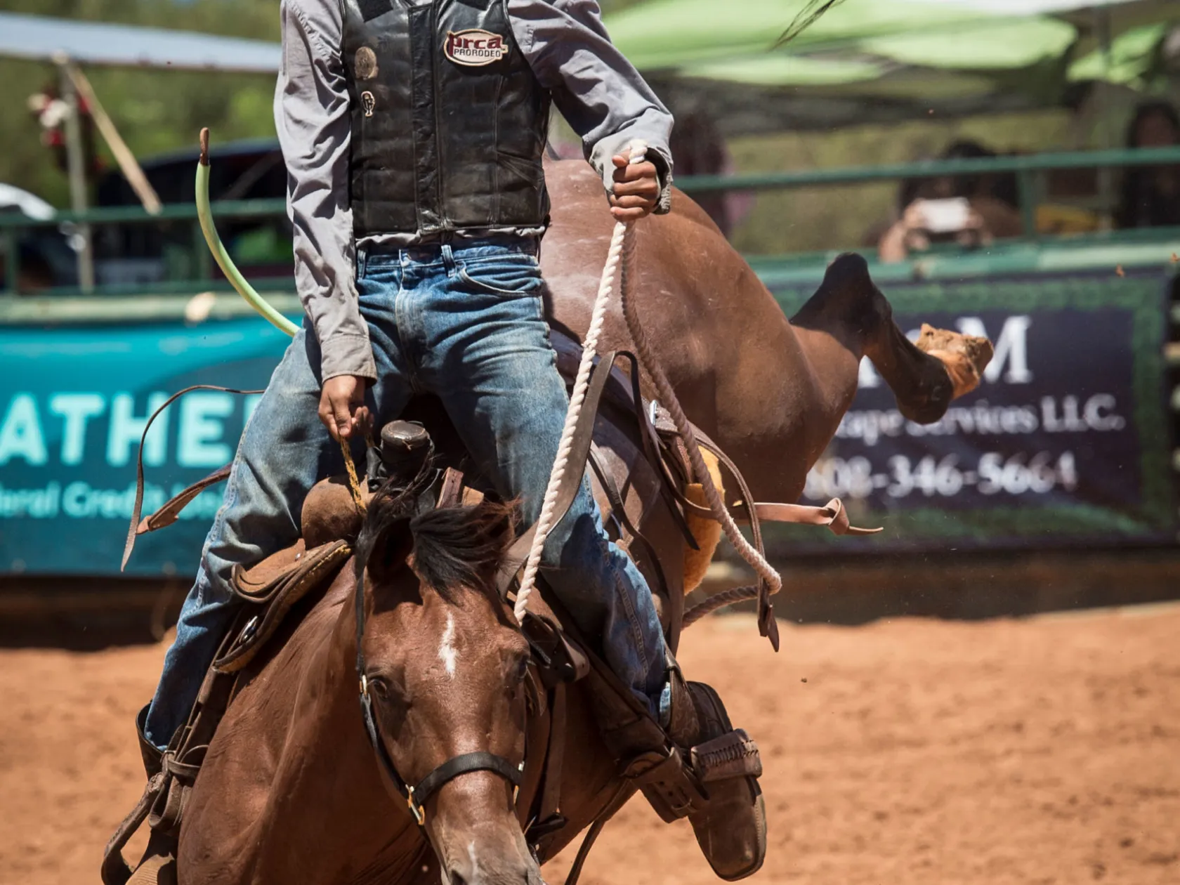 a man riding a horse in the dirt