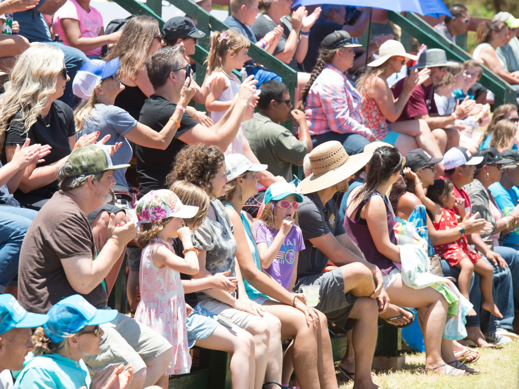 a group of people sitting in front of a crowd