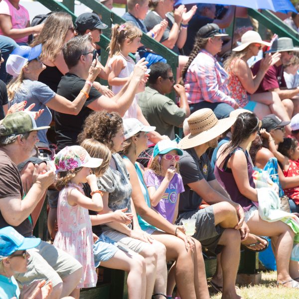 a group of people sitting in front of a crowd