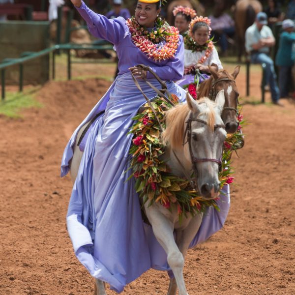 a person riding a horse in the dirt